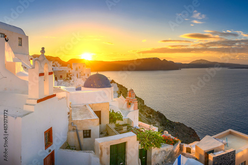 Picturesque sunrise on famous view resort over Oia town on Santorini island  Greece  Europe. famous travel landscape. Summer holidays. Travel concept background.