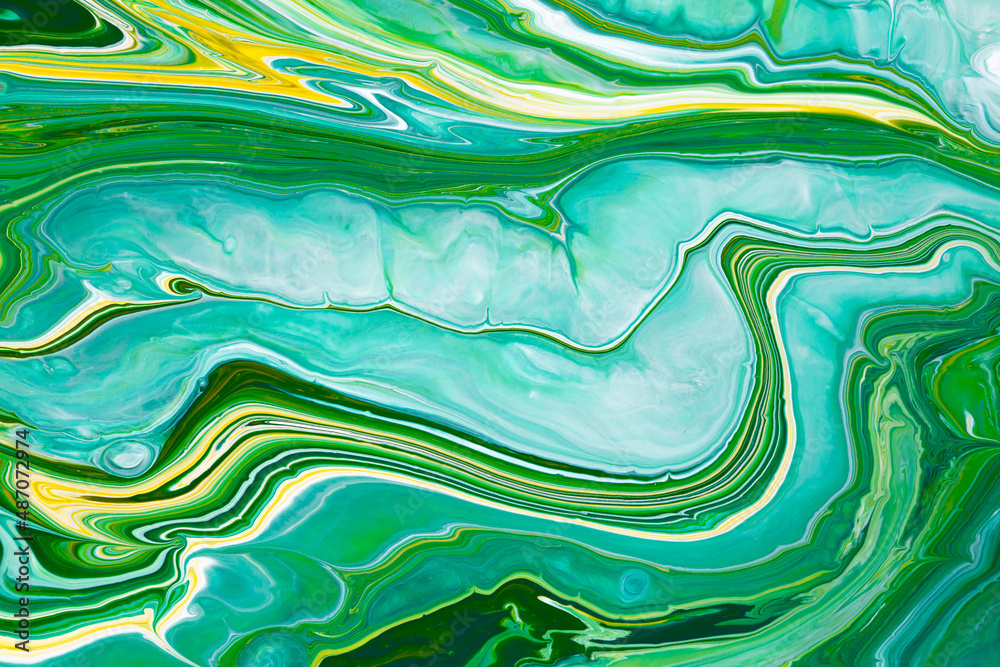 Fluid art texture. Backdrop with abstract iridescent paint effect. Liquid acrylic picture that flows and splashes. Mixed paints for posters or wallpapers. Green, blue and yellow overflowing colors.
