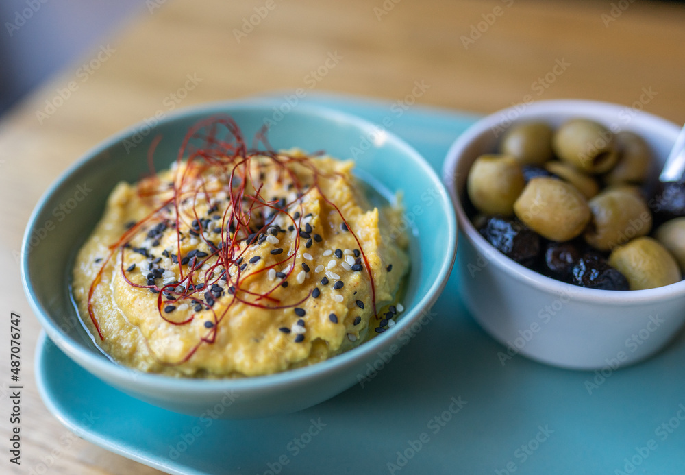hummus on a plate in a restaurant