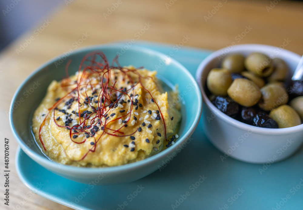 hummus on a plate in a restaurant hummus on a plate in a restaurant