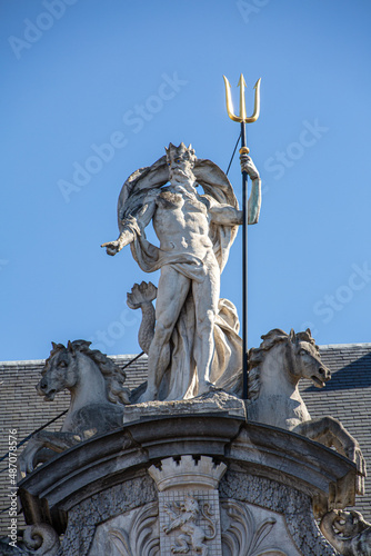 Fotografie Statue of Poseidon in the city of Ghent with blue background