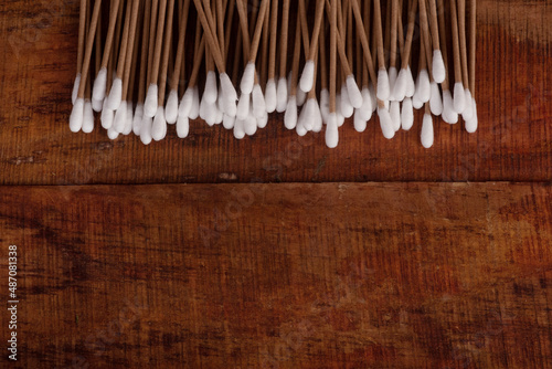 cotton sticks for cleaning the ears close-up in the up of canva on a wooden background. Close-up. top view. zero waste