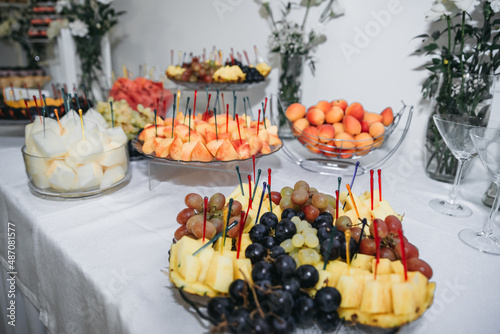 Dessert on the table. Wedding desserts. Wedding table. Serving. Cakes. Fruits. Food