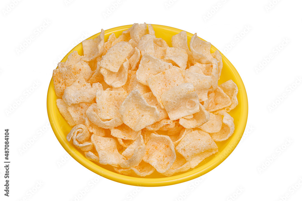 potato chips in yellow plate isolated on white background potato chips in yellow plate isolated on white background