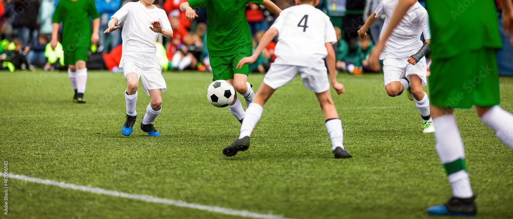 Soccer football duel moment. Two young soccer team on tournament match. Players compete in a game Soccer football duel moment. Two young soccer team on tournament match. Players compete in a game