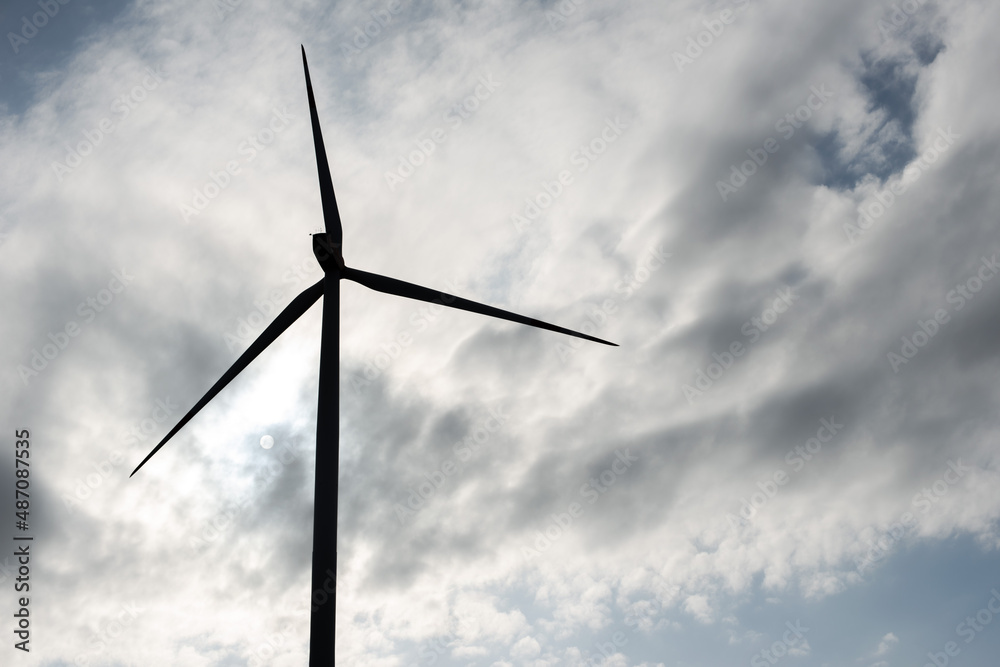 A wind turbine against a dramatic cloudy sky A wind turbine against a dramatic cloudy sky