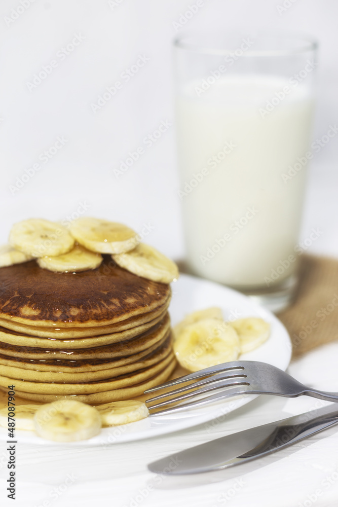 Pancakes with maple syrup and bananas. Pancakes with maple syrup and bananas.