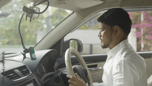 Cab driver using map navigation or gprs on mobile phone for travelling - cocnept of technology, application, smartphone and internet connection photo