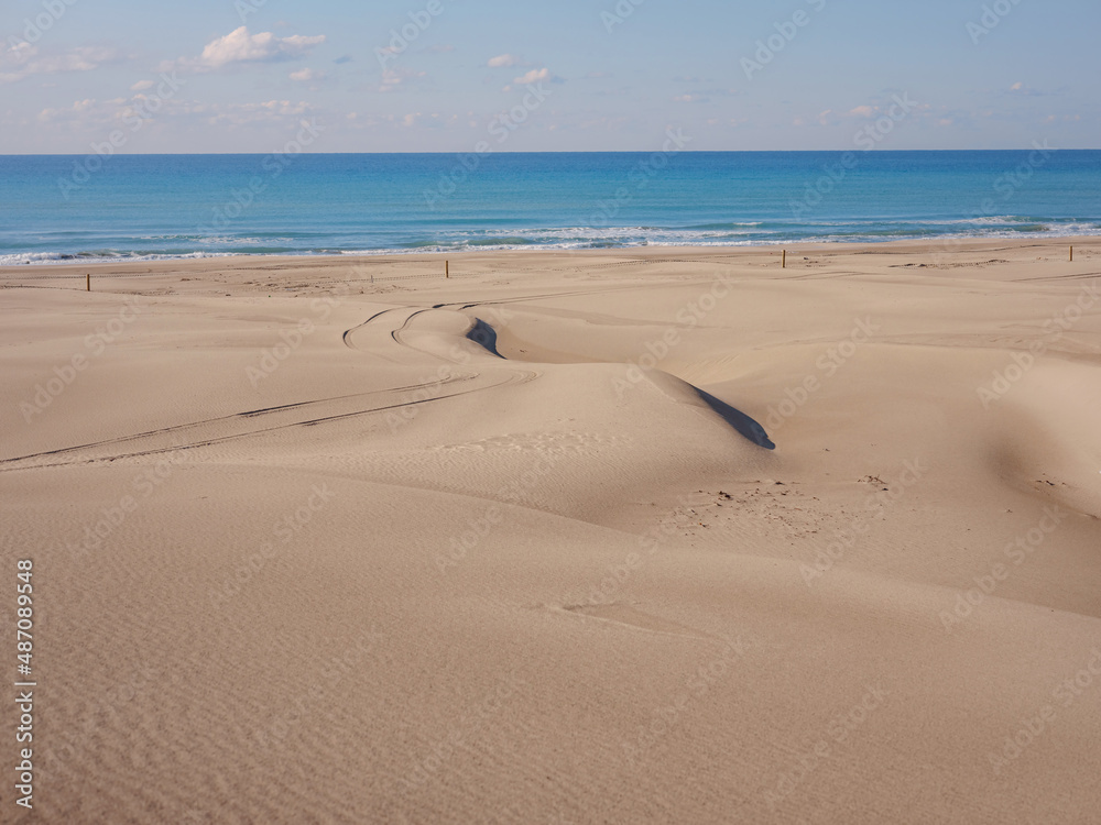 Patara beach is famous tourist landmark and natural destination in Turkey. Majestic view of orange sand dunes and hills glows Patara beach is famous tourist landmark and natural destination in Turkey. Majestic view of orange sand dunes and hills glows