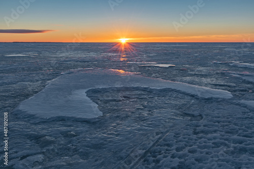 Winter evening on Lake Peipus, Pskov region, Russia photo