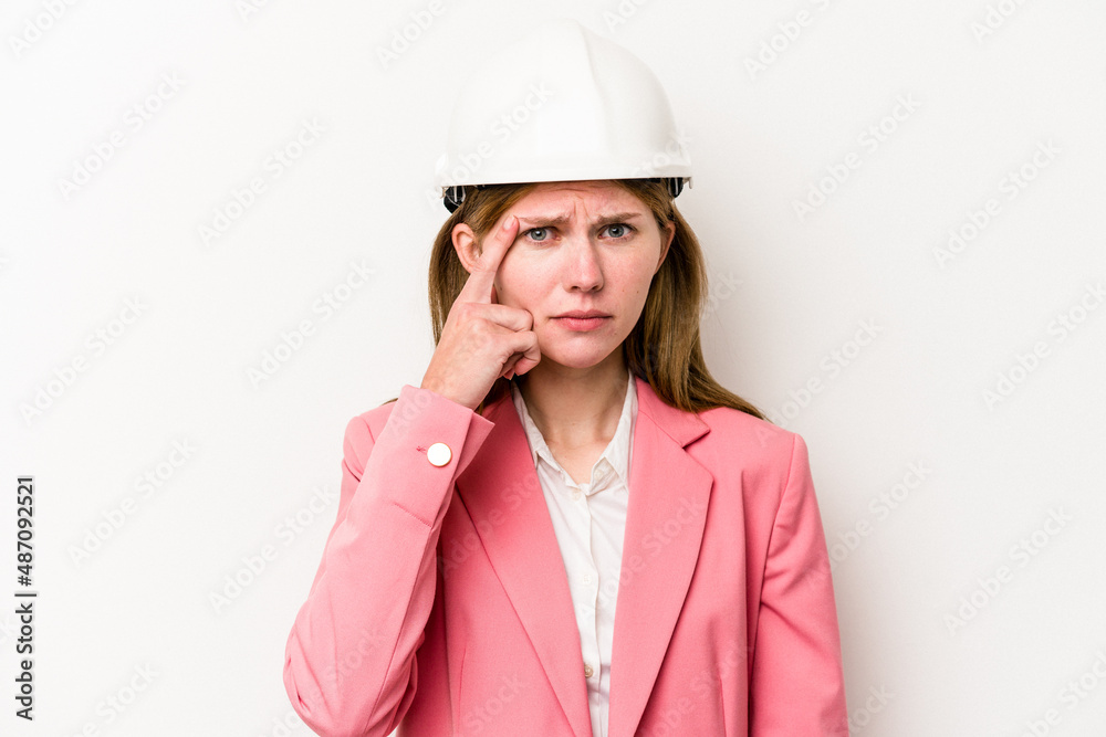 Young architect English woman with helmet isolated on white background showing a disappointment gesture with forefinger. Young architect English woman with helmet isolated on white background showing a disappointment gesture with forefinger.