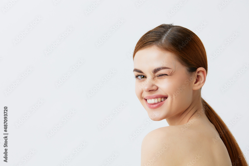 beautiful woman red hair bare shoulders cosmetics skincare light background beautiful woman red hair bare shoulders cosmetics skincare light background