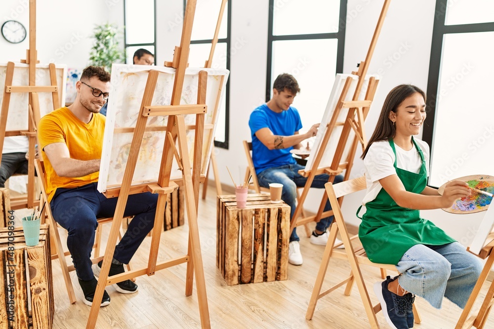 Group of people smiling happy drawing at art studio.