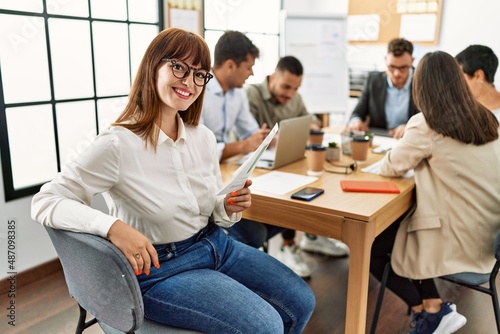 Group of business workers smiling happy working at the office.