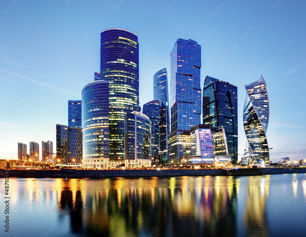 Moscow City skyline.  International Business Centre at night time with Moskva river.