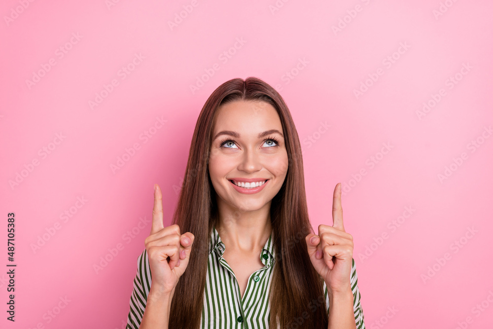 Photo of dreamy cute pretty lady direct fingers empty space wear striped green shirt isolated pink color background Photo of dreamy cute pretty lady direct fingers empty space wear striped green shirt isolated pink color background