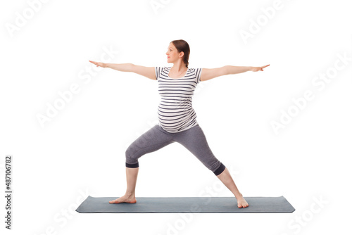 Pregnancy yoga exercise - pregnant woman doing asana virabhadrasana 2 - warrior pose isolated on white background