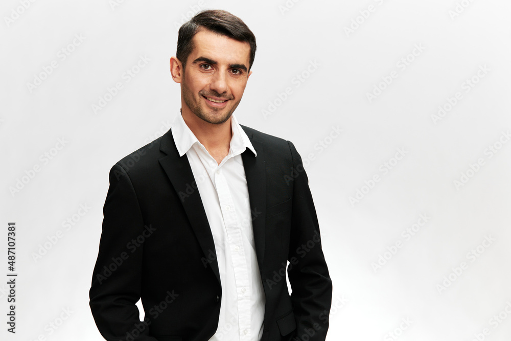 Fototapeta premium successful man in a stylish suit smile posing self-confidence isolated background