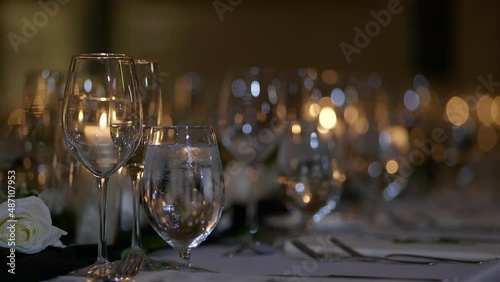 Numerous wine glasses standing in a row