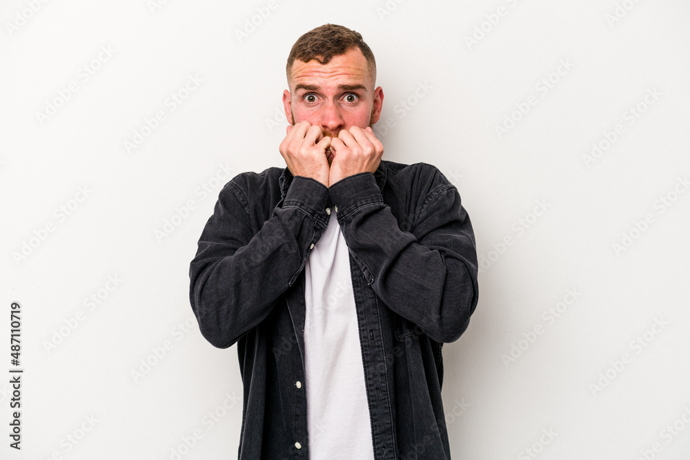 Young caucasian man isolated on white background biting fingernails, nervous and very anxious. Young caucasian man isolated on white background biting fingernails, nervous and very anxious.