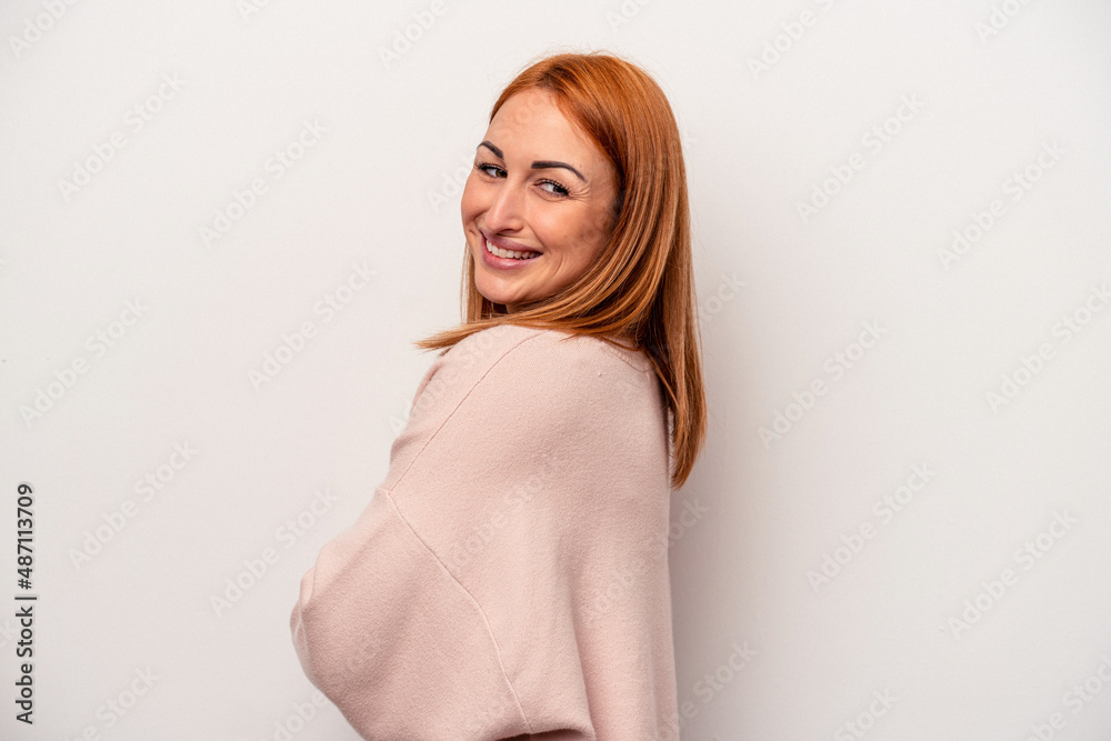 Fototapeta premium Young caucasian woman isolated on white background laughing and having fun.