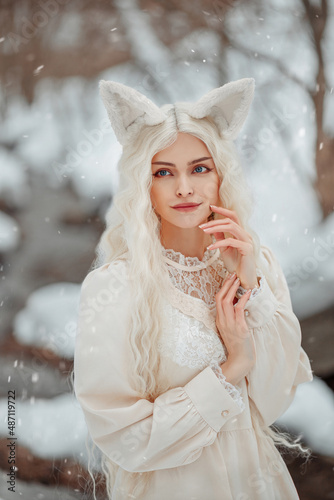 Fairytale white fox girl on the background of a winter river. Kitsune on the background of winter nature. Cat girl with white hair on a winter background. photo