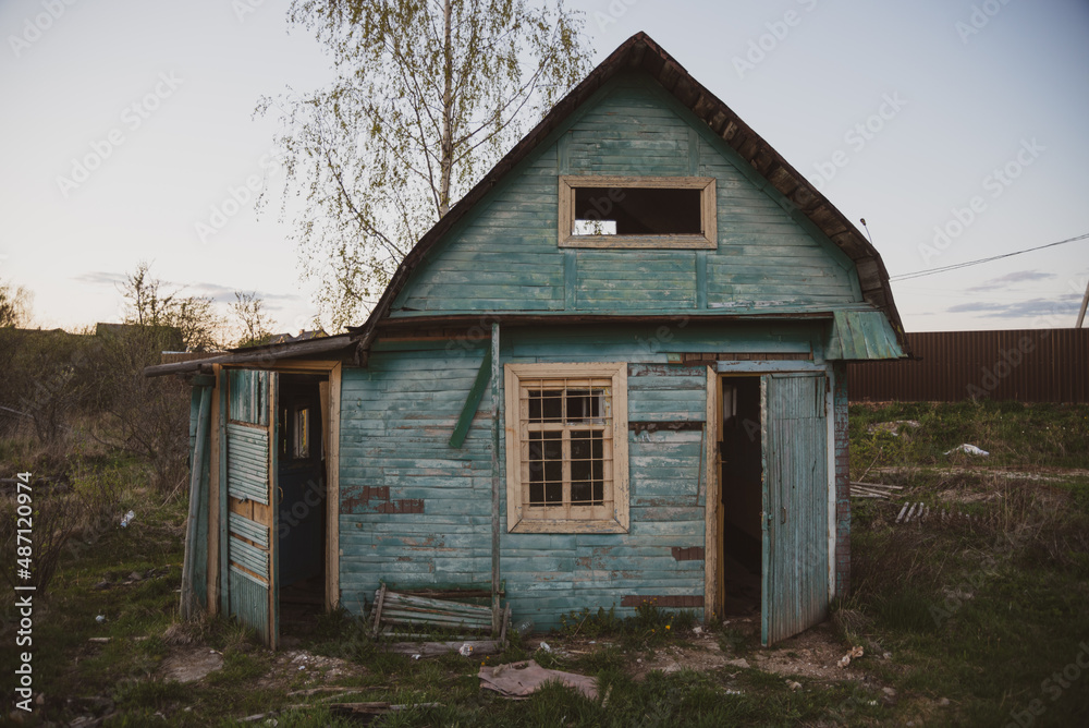 an old rustic country house of blue color an old rustic country house of blue color