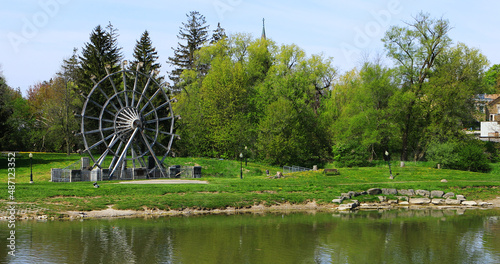 Bild auf Leinwand View of a large waterwheel in New Hamburg, Ontario, Canada