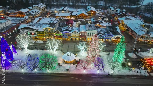 Cinematic 4K aerial drone after sunset footage of Christmas displays in Leavenworth, a Bavarian-styled tourist destination village in the Cascade Mountains, in Washington State photo