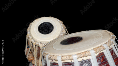 Fotografie Tabla, Table musical instrument, traditional Indian drum set isolated on black background with copy space