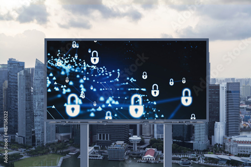 Padlock icon hologram on road billboard over panorama city view of Singapore at sunset to protect business, Southeast Asia. The concept of information security shields.