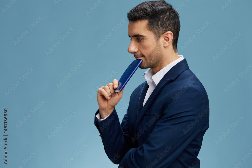 businessman with a notepad thoughtful look posing self-confidence isolated background businessman with a notepad thoughtful look posing self-confidence isolated background