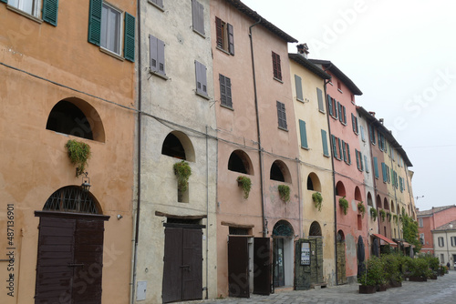 Colorful buildings in Brisighella with the arched windows of the elevated    donkey road   