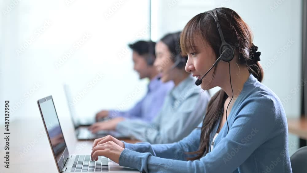 Asian call center and customer service using laptop computer and calls talk support to customers and wearing headset, Telemarketing, customer support agent provide service on telephone concept Asian call center and customer service using laptop computer and calls talk support to customers and wearing headset, Telemarketing, customer support agent provide service on telephone concept