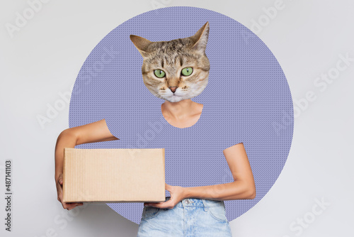 Fototapeta Naklejka Na Ścianę i Meble -  A young courier headed by cat head holds a cardboard box on a gray with lilac circle background. A delivery girl delivers the package. Trendy collage in magazine style. Contemporary art. Modern design