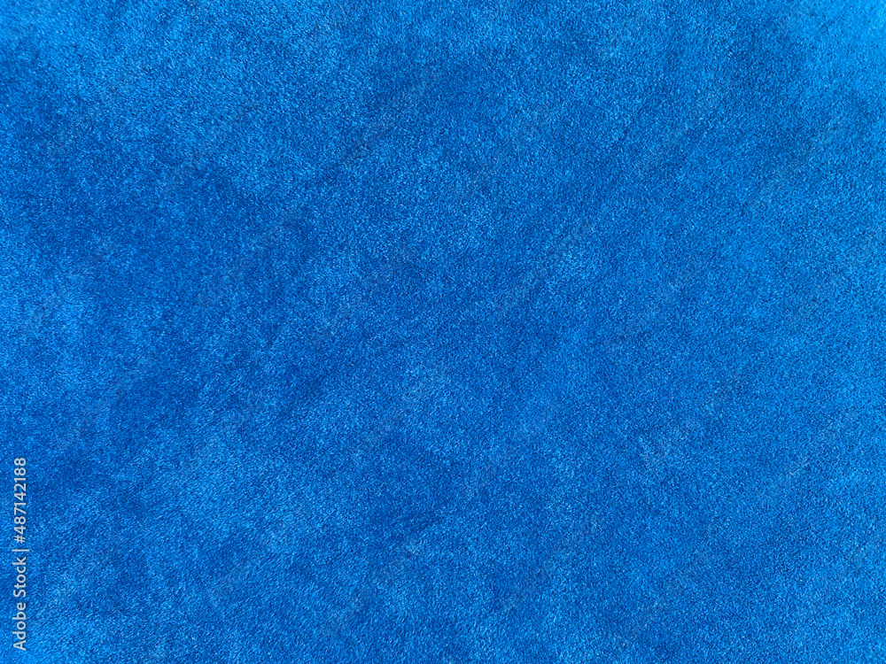 Light blue velvet fabric texture used as background. Empty light blue ...