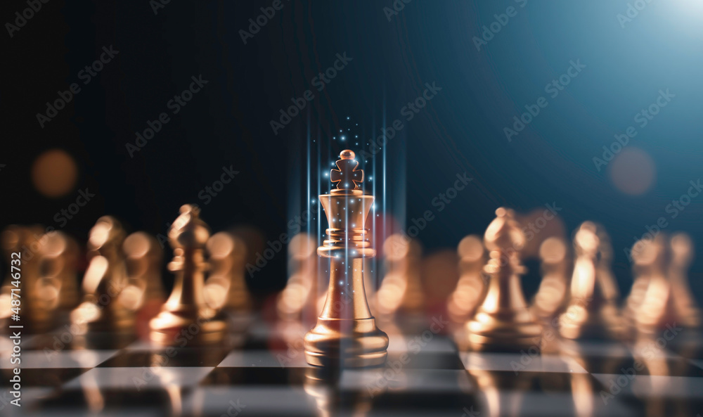 Golden king chess stand in front of others chess pieces. Leadership business teamwork and marketing strategy planing concept.