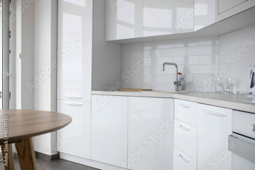 Modern kitchen, white built-in appliances interior.