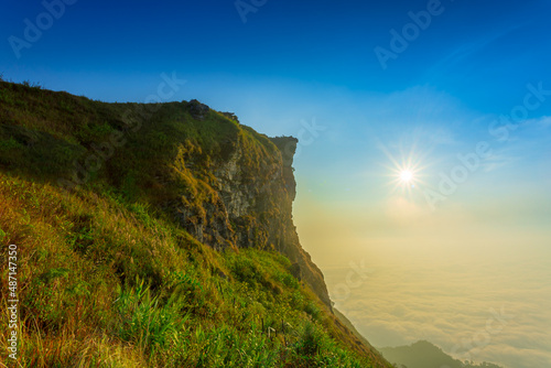 Beautiful landscape nature on peak mountain with sunset in winter at viewpoint Phu Chi Fa or Phu chee fah Forest Park in Chiang Rai , Thailand