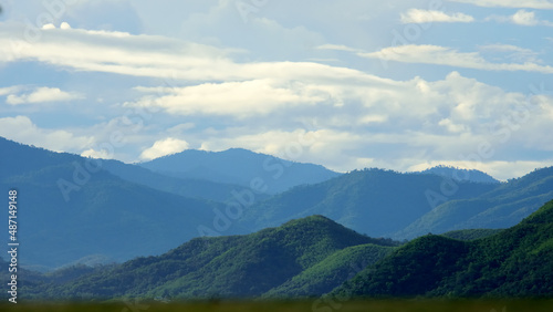 tropical forest landscape with layer of mountains,forest conservation background