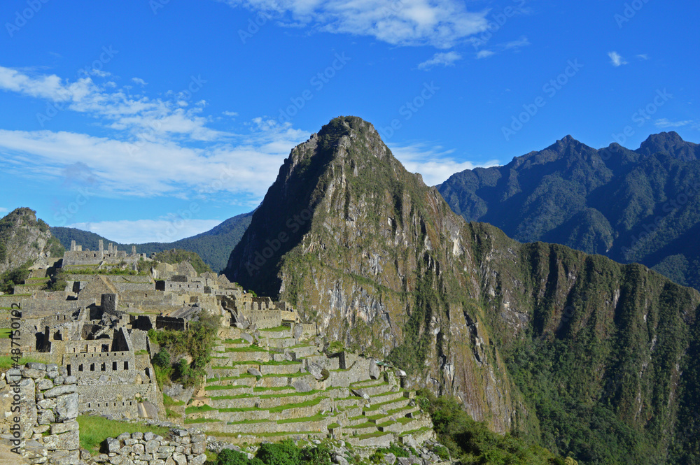 View of machu picchu between the mountains.