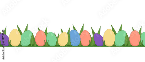seamless pattern of colored easter eggs and fresh green grass