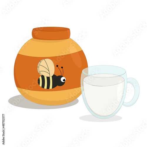 a jar of sweet bee honey with a mug of cold milk