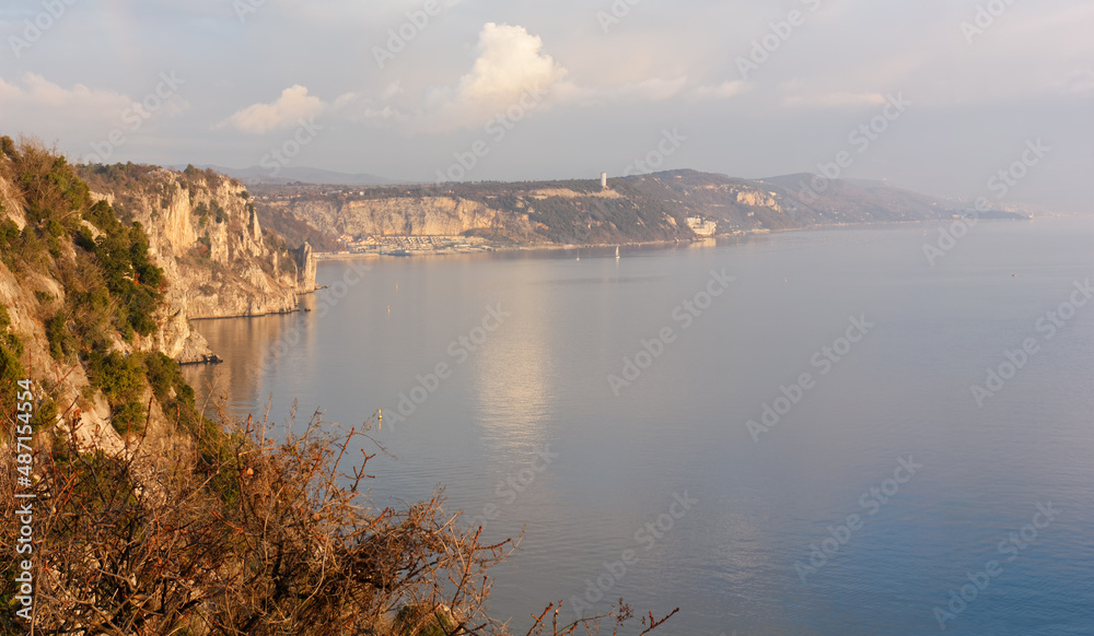 Duino cliffs and Adriatic coastline during a winter sunset near Trieste, Italy