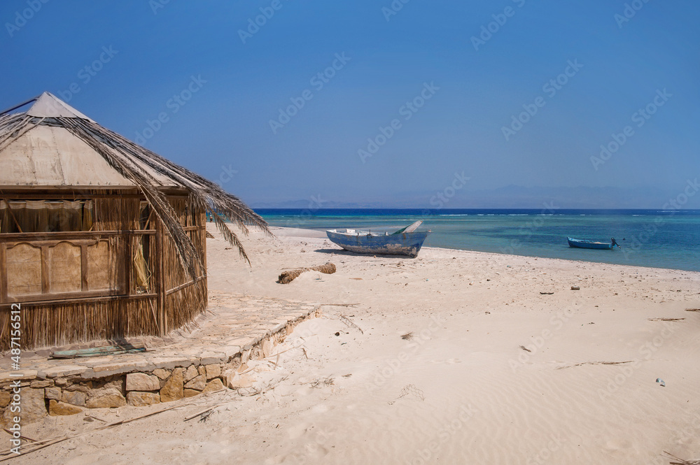 old wooden fishing boats resting on the beach of the bay blue lagoon in egypt old wooden fishing boats resting on the beach of the bay blue lagoon in egypt