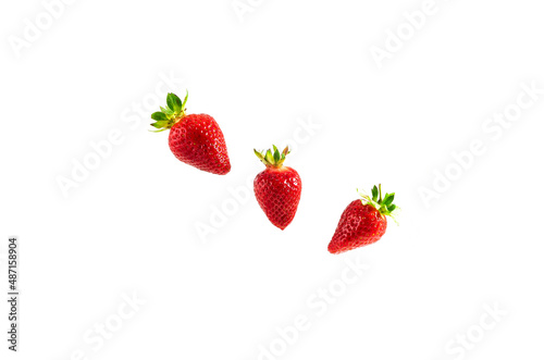 Fototapeta Naklejka Na Ścianę i Meble -  Red strawberries with green leaves on a white background