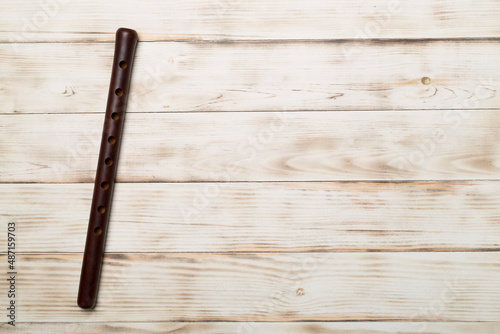 Armenian national musical instrument duduk on wooden background. Top view