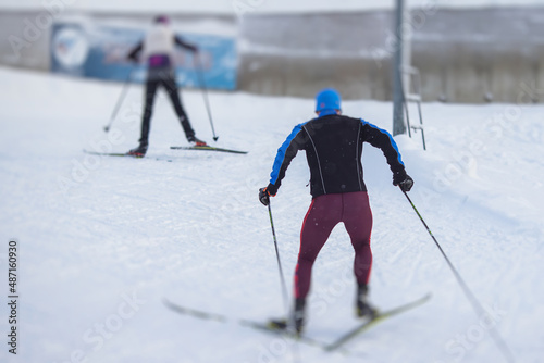 Alpine skiing race slalom competition, athletes ready to start ski competitions on a piste slope, nordic ski skier on the track in winter, giant slalom, winter sport and acitivities concept photo