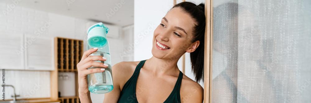 Smiling healthy young white woman in sportswear Smiling healthy young white woman in sportswear