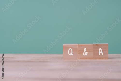 Q&A or "Q and A" with wooden blocks with letters, questions and answers customer service and support concept , Copy space.